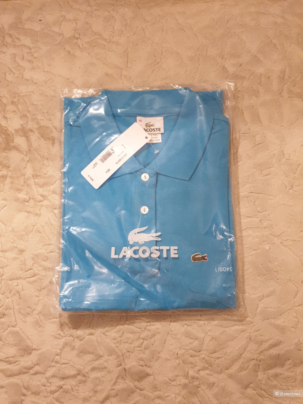 Поло фирмы Lacoste 42 размера