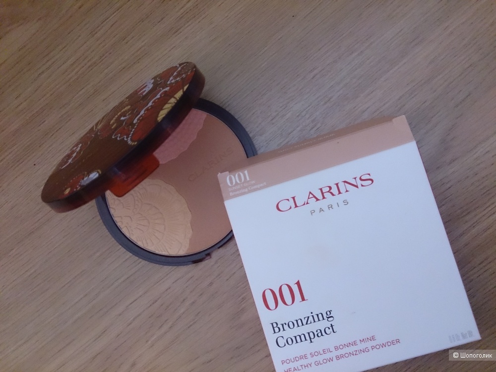 Бронзирующая пудра  с эффектом сияния Clarins 001