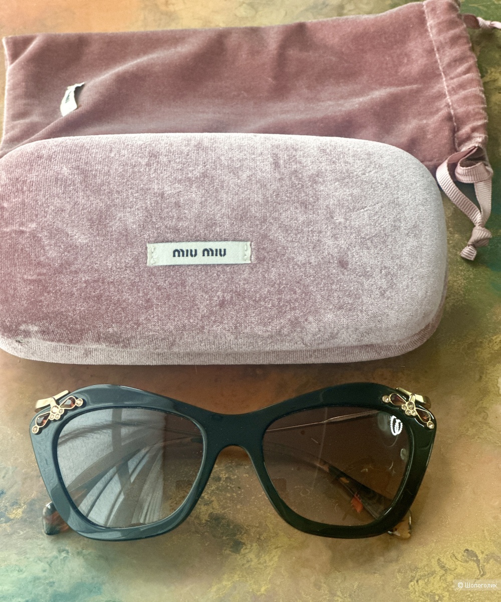 Очки Miu Miu.